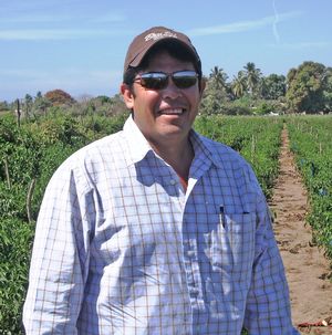 Dr. Juan Manuel Quintana Juan Manuel out in the fields.